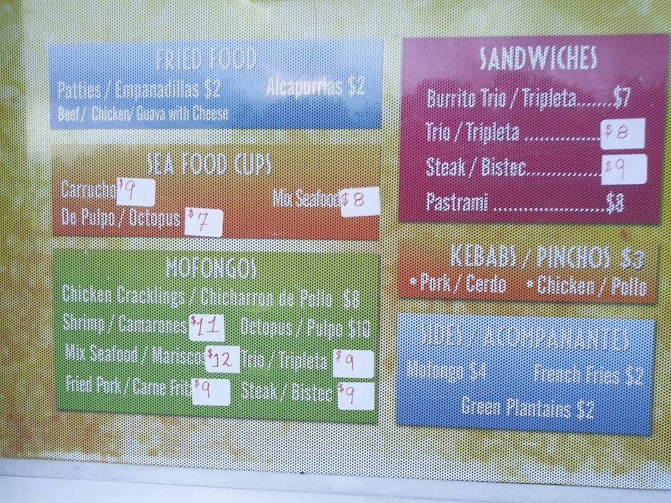 Spanish and English menu sections on paper.